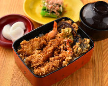 Tempura served over rice in a lacquered box