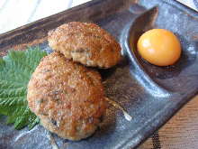 Meatballs served with egg yolk