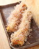 Deep-fried and skewered herring eggs on kelp