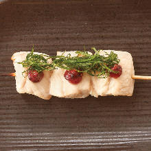 Skewered chicken tenderloin with plum and perilla