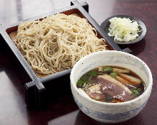 Buckwheat noodles served on a bamboo strainer with duck