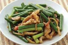 Stir-fried pork and garlic scapes