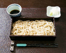 Buckwheat noodles served on a bamboo strainer