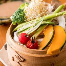 Vegetables steamed in a bamboo steamer