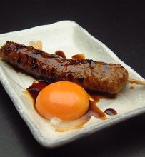 Meatballs served with egg yolk