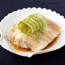 Boiled pork belly topped with garlic sauce