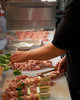 Our staff skewer meat one by one Our staff skewer meat one by one