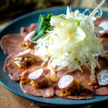 Slow-cooked beef tongue slices