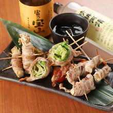 Grilled meat-wrapped skewer