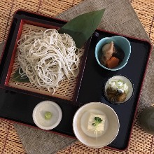 Buckwheat noodles served on a bamboo strainer