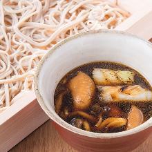 Buckwheat noodles served on a bamboo strainer with duck