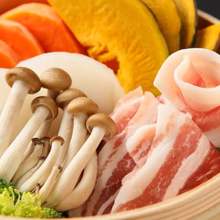 Pork steamed in a bamboo steamer