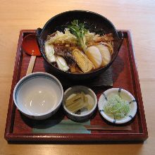 Wheat noodles boiled in a ceramic pot