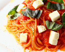 Pasta with tomato sauce, mozzarella, and basil