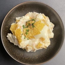 Potato salad topped with hot spring eg