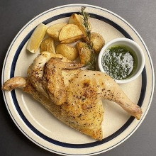 Grilled half bone-in chicken