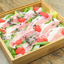 Pork steamed in a bamboo steamer