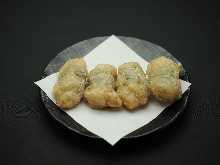 Marinated deep-fried chicken tenderloin and pickled plum rolled in perilla leaf