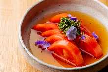 Scalded tomato steeped in dashi soup broth