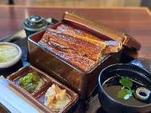 Extra premium eel served over rice in a lacquered box