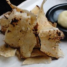 Charcoal-seared ray fin