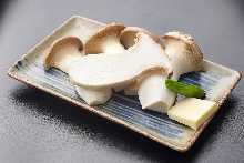 Grilled eringi mushrooms with butter