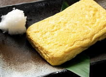 Japanese-style rolled omelette garnished