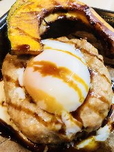 Meatballs served with egg yolk