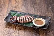 Squid poppo-yaki (Grilled squid mantle stuffed with squid tentacles and entrails)