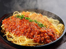 Pasta with meat sauce, topped with pork cutlet