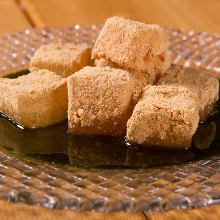 Warabimochi (bracken-starch dumpling covered in sweet, toasted soybean flour)