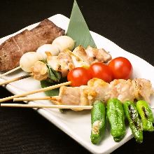 Grilled pork wrapped cherry tomato skewer
