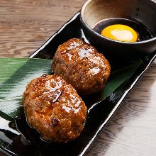 Meatballs served with egg yolk