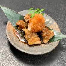 Chicken skin with sauce and grated radish