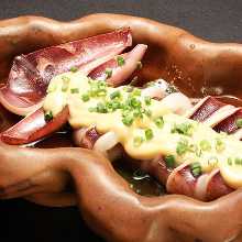 Squid poppo-yaki (Grilled squid mantle stuffed with squid tentacles and entrails)