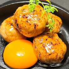 Meatballs served with egg yolk
