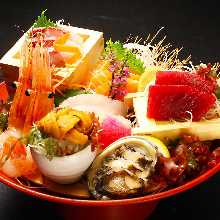 Assorted luxurious sashimi including sea urchin and abalone