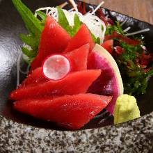 Raw bluefin tuna sashimi from Nagasaki or salmon sashimi from Okhotsk or Erimo, whole live sashimi