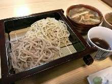 Buckwheat noodles served on a bamboo strainer