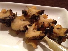 Grilled whelk skewer