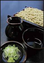 Buckwheat noodles served on a bamboo strainer