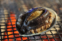 Grilled live abalone