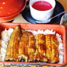 Premium eel served over rice in a lacquered box