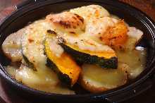 Grilled potatoes and pumpkin with cheese