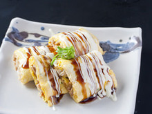 Tonpei-yaki (stir-fried cabbage and meat topped with egg) Tonpei-yaki (stir-fried cabbage and meat topped with egg)