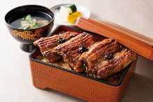 Premium eel served over rice in a lacquered box