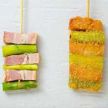 Fried pork wrapped asparagus skewer