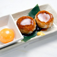 Meatballs served with egg yolk