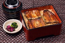 Eel served over rice in a lacquered box