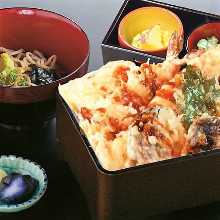 Tempura served over rice in a lacquered box